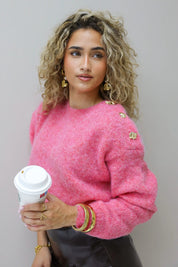 Gebreide trui gouden knoop detail op de schouder felroze dames winter trui dames