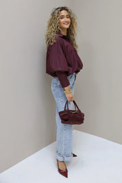 Korte ballon blouse lange mouwen bordeaux brede manchet knoopjes