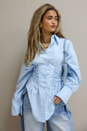 blauwe blouse dames studio achterkant ladylike