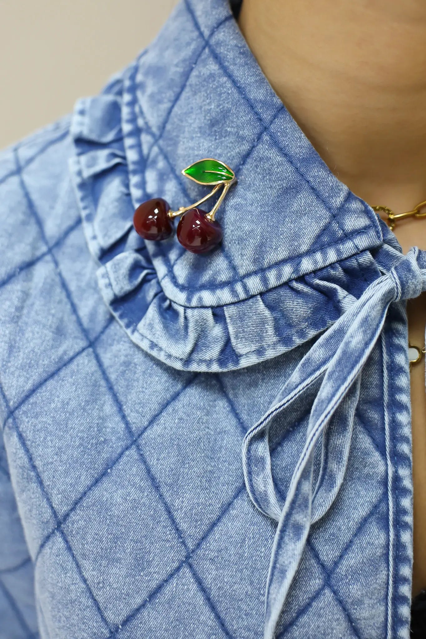 broche kersen bordeaux