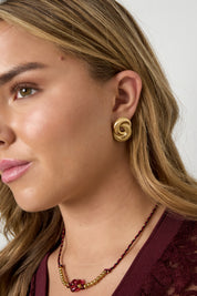 Oorbellen Infinity Twist Goud