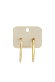 Achterkant van gouden cirkel oorbellen op kaartje, stainless steel