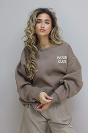 Close-up van de Paris Club Sweater in beige