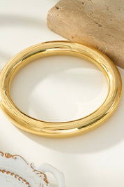 Ronde goudkleurige armband met glad oppervlak