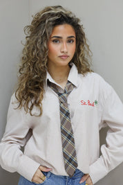 geruite beige stropdas geknoopt