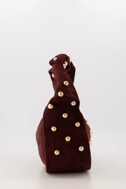tas suede lottie bordeaux handtas zijaanzicht goudkleurige studs ladylike